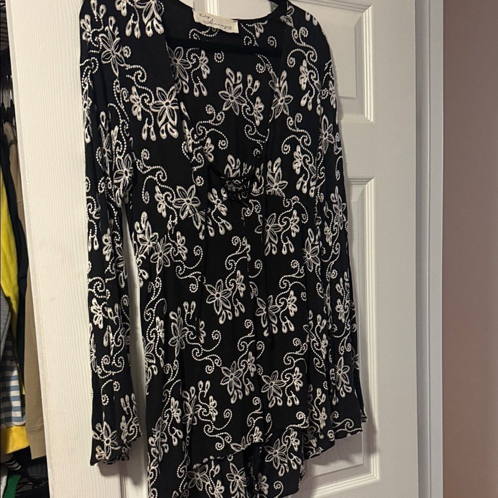 Chic Black and White Floral Shorts Romper Flowy Bell Sleeves Low Cut Front & Tie